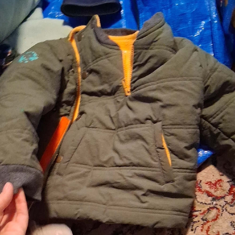 Green Quilted Jacket with Orange Accents